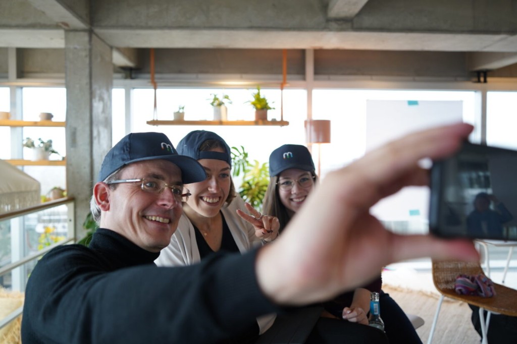 macc team selfie with branded caps